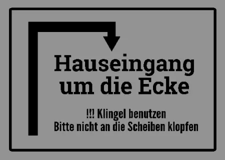 Wegweiser Hauseingang um die Ecke Bild